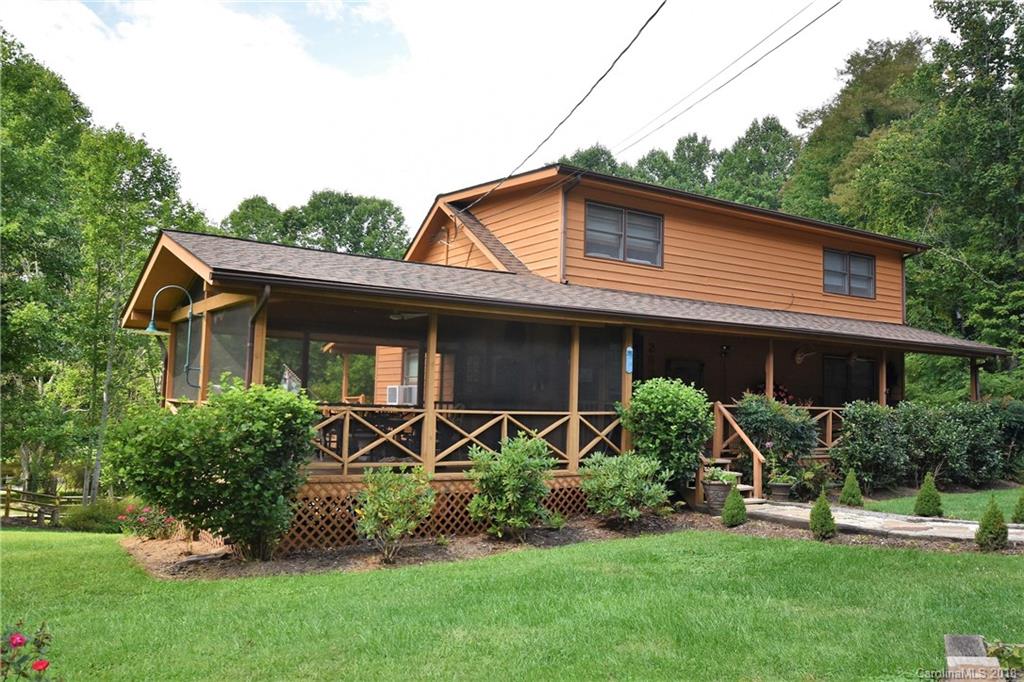 263 Laurel Branch Road Maggie Valley, NC 28751 - Photo 27 of 32 a front view of a house with garden