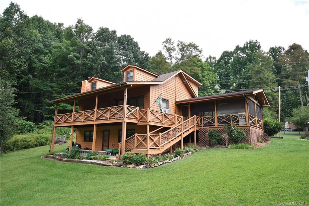 263 Laurel Branch Road Maggie Valley, NC 28751 - Photo 29 of 32 a front view of a house with garden