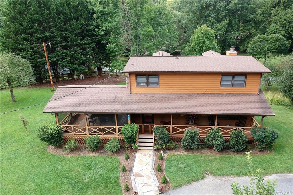263 Laurel Branch Road Maggie Valley, NC 28751 - Photo 30 of 32 a front view of a house with a yard