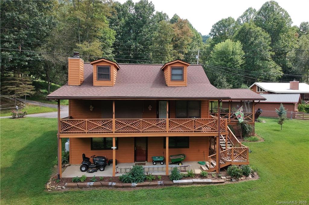 263 Laurel Branch Road Maggie Valley, NC 28751 - Photo 32 of 32 a front view of a house with garden