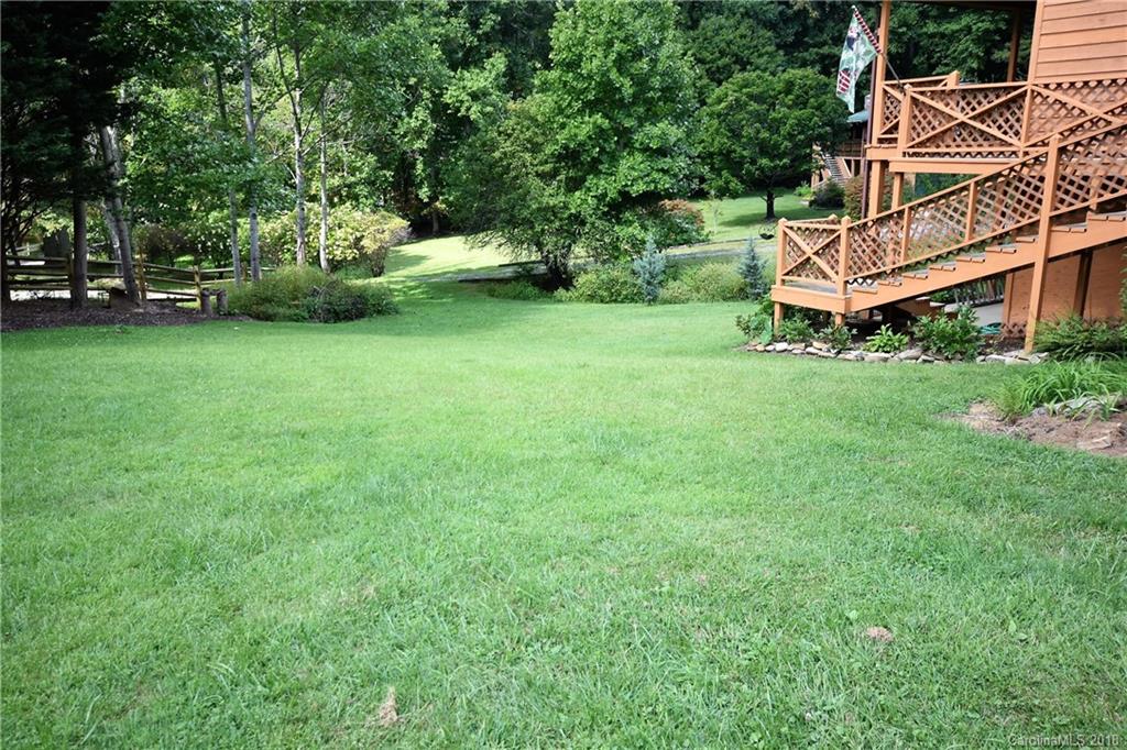 263 Laurel Branch Road Maggie Valley, NC 28751 - Photo 5 of 32 a view of a house with a yard and sitting area