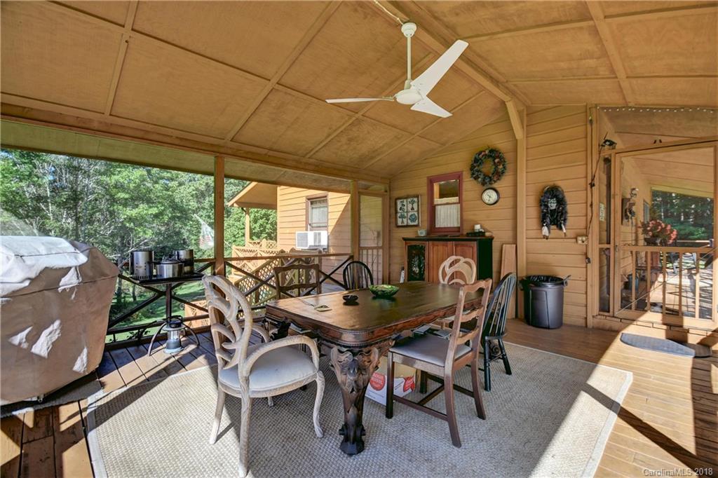 263 Laurel Branch Road Maggie Valley, NC 28751 - Photo 6 of 32 a dining room with furniture and wooden floor