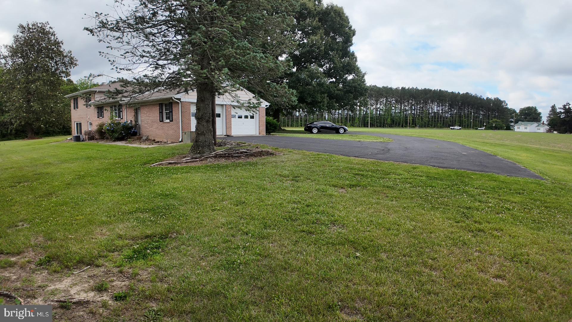 8936 Goldsborough Neck Road Easton, MD 21601 - Photo 7 of 13 a front view of a house with yard and green space