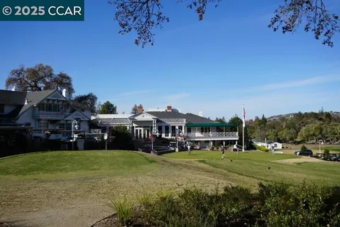 a view of a house with a big yard