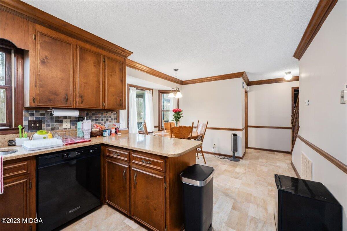 347 Castlegate Road Macon, GA 31210 - Photo 17 of 34 a kitchen with a sink appliances and cabinets