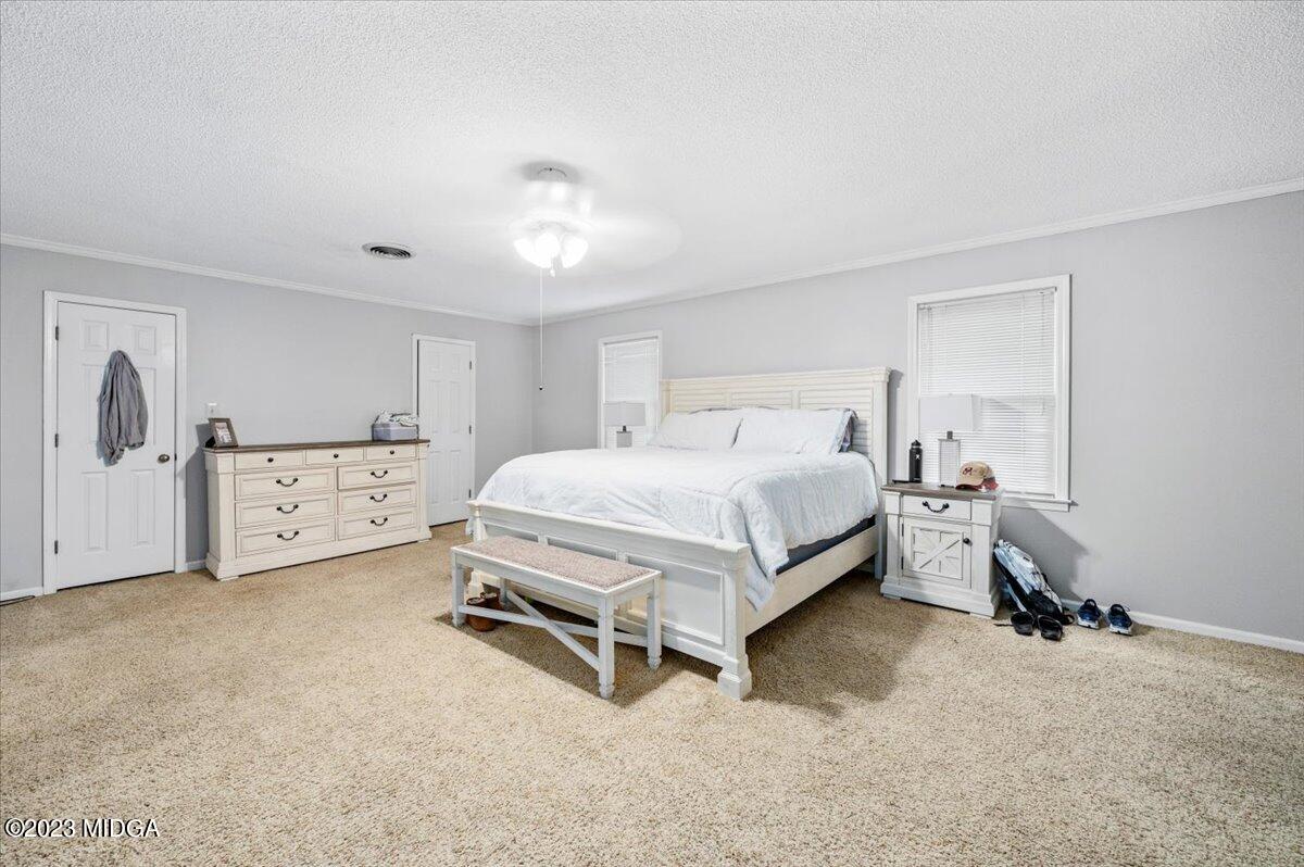347 Castlegate Road Macon, GA 31210 - Photo 19 of 34 a bedroom with a bed and a cabinets