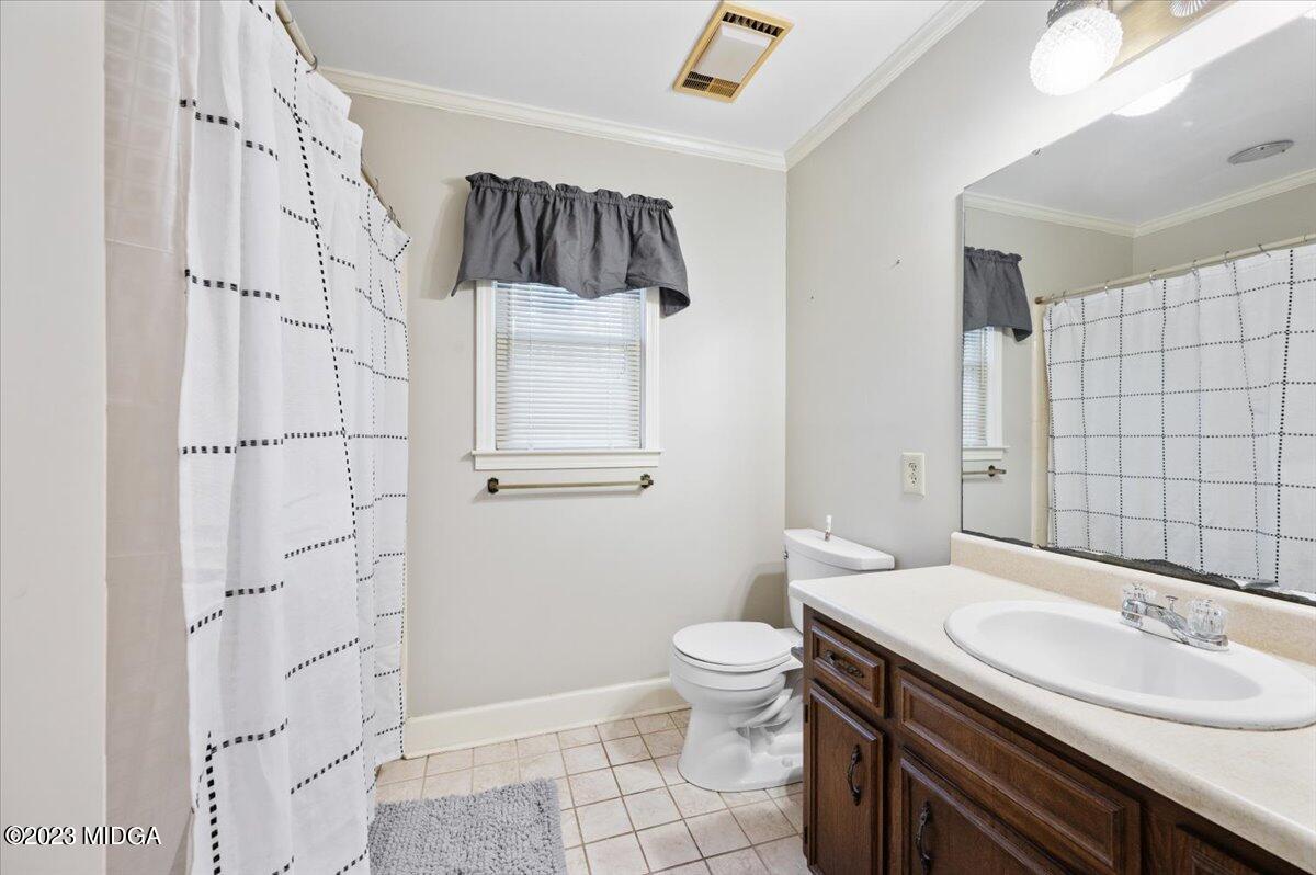 347 Castlegate Road Macon, GA 31210 - Photo 24 of 34 a bathroom with a sink a toilet and shower