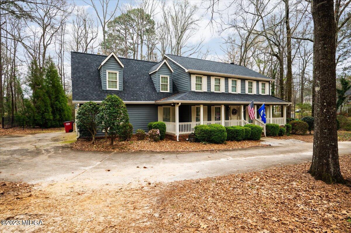 347 Castlegate Road Macon, GA 31210 - Photo 3 of 34 a view of a brick building next to a road with a house