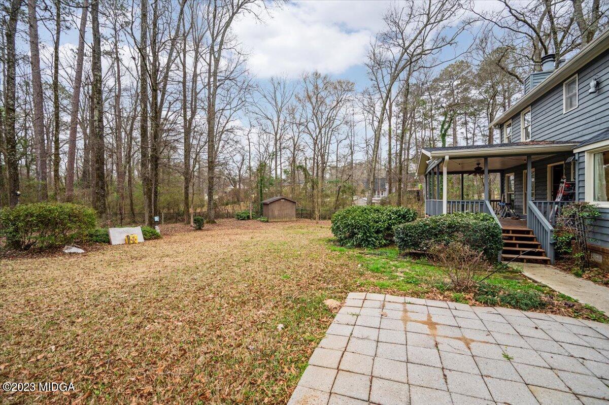 347 Castlegate Road Macon, GA 31210 - Photo 32 of 34 a backyard of a house with lots of green space
