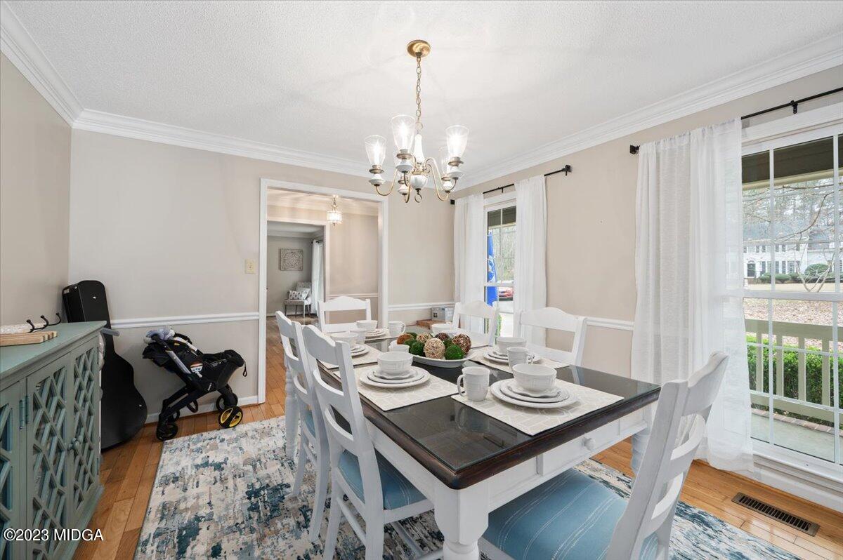 347 Castlegate Road Macon, GA 31210 - Photo 9 of 34 a view of a dining room with furniture and wooden floor