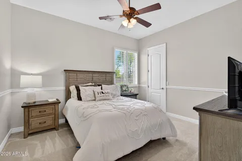 a very nice looking room with a ceiling fan