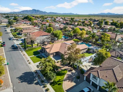an aerial view of residential houses with outdoor space