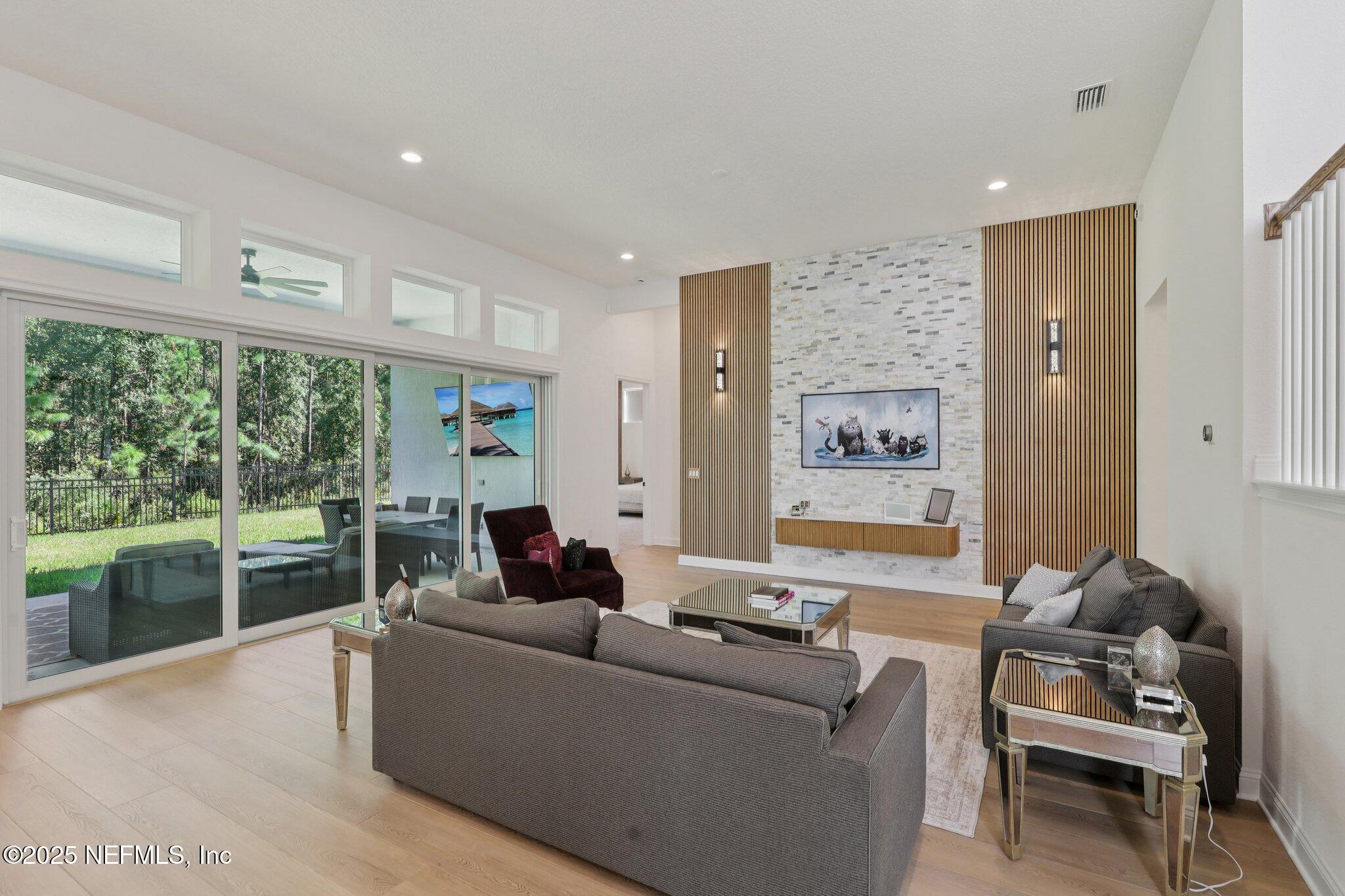 3089 Spiro Circle Jacksonville, FL 32246 - Photo 13 of 83 a living room with furniture and a large window