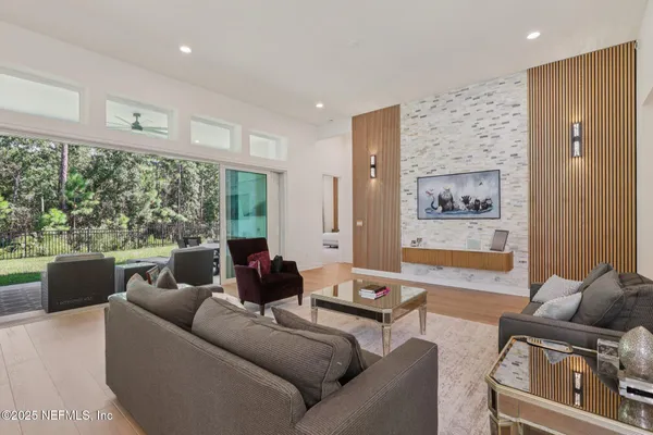 a kitchen with kitchen island a white counter top space cabinets and stainless steel appliances