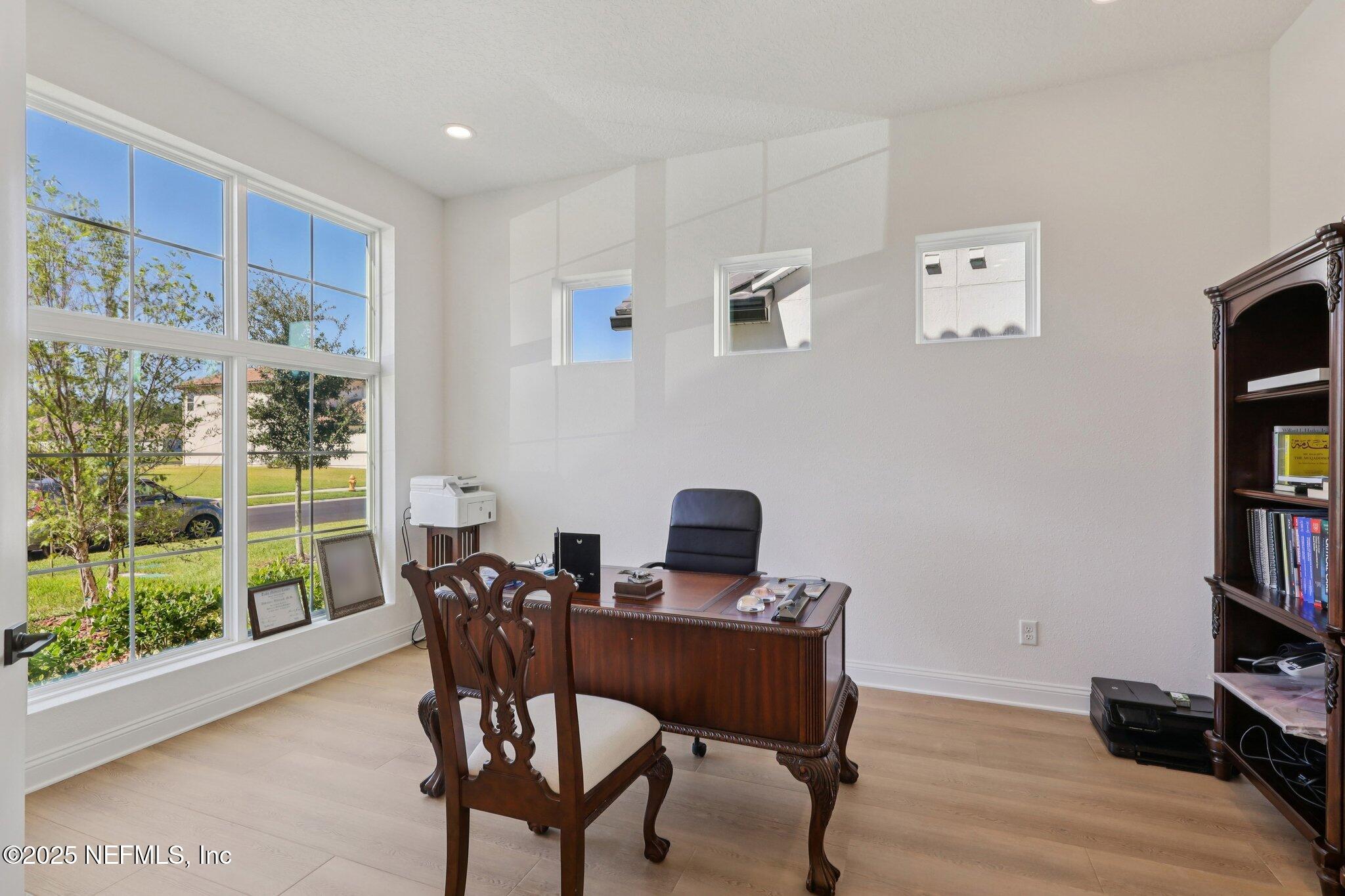 3089 Spiro Circle Jacksonville, FL 32246 - Photo 30 of 83 a view of a workspace with furniture and a window