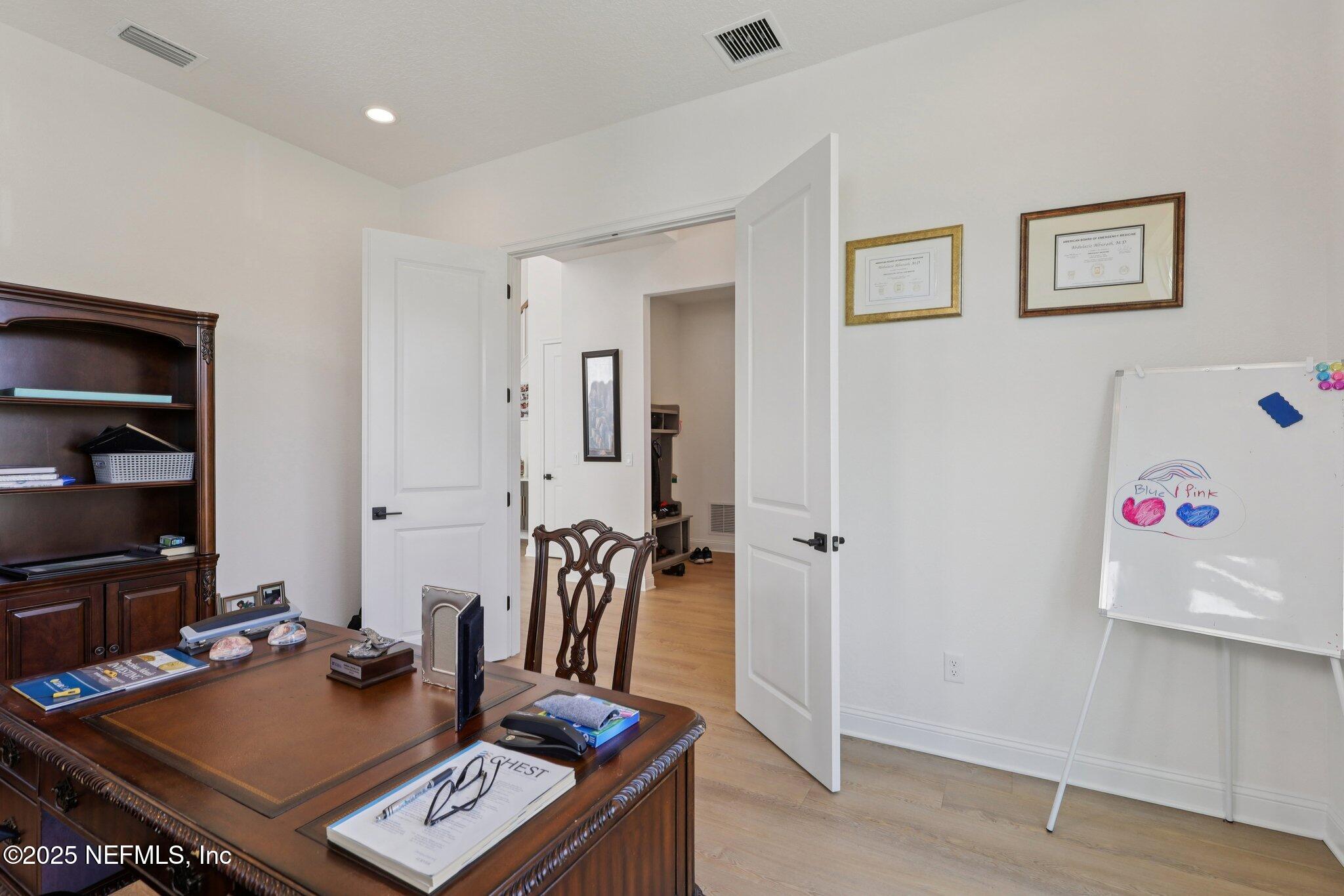 3089 Spiro Circle Jacksonville, FL 32246 - Photo 31 of 83 a view of a workspace with furniture and wooden floor