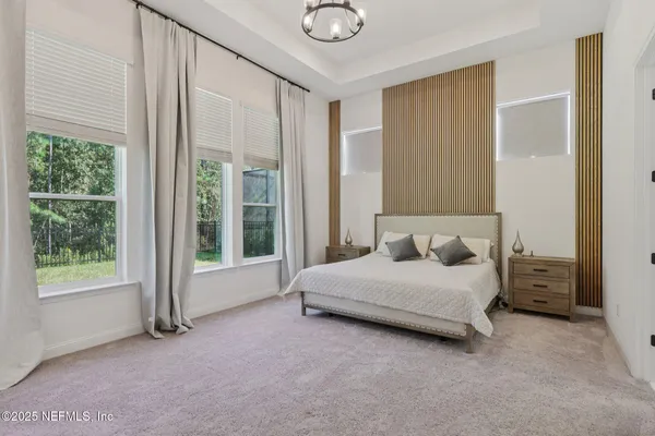 a bedroom with furniture and a book shelf