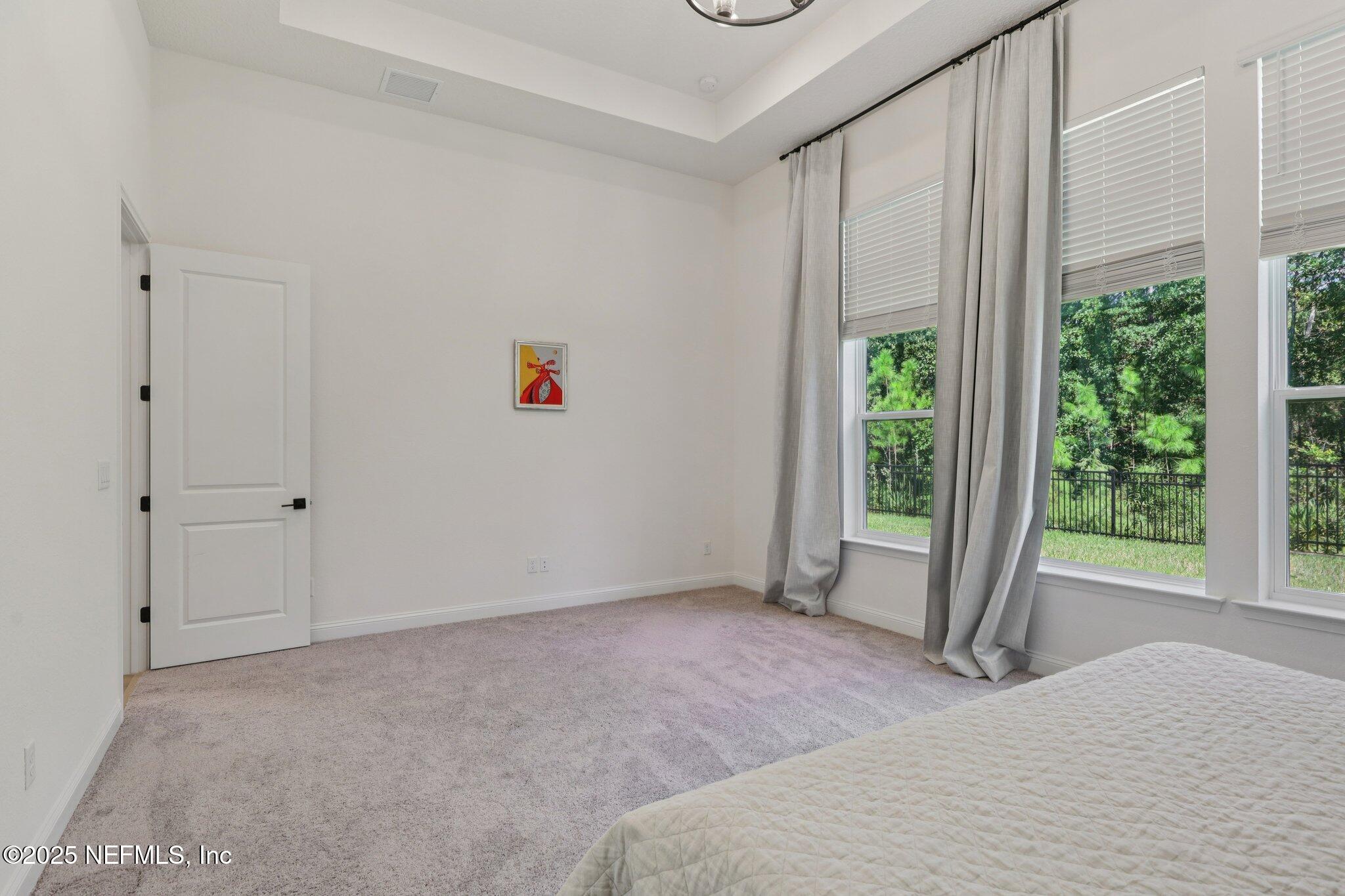 3089 Spiro Circle Jacksonville, FL 32246 - Photo 37 of 83 a bedroom with a bed and a window