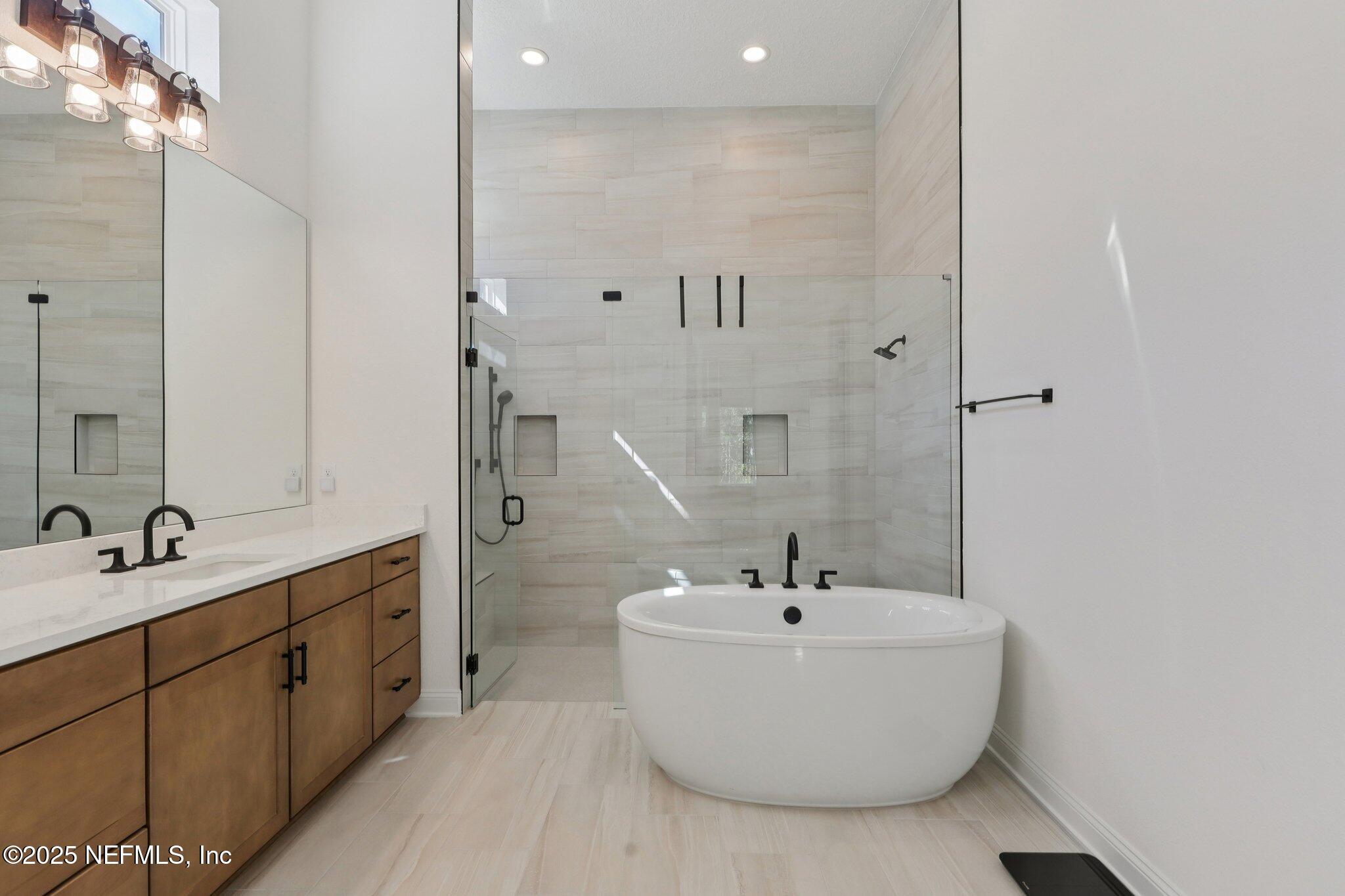 3089 Spiro Circle Jacksonville, FL 32246 - Photo 38 of 83 a bathroom with a double vanity sink mirror and double