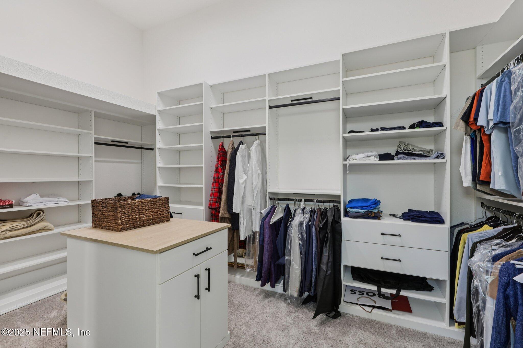 3089 Spiro Circle Jacksonville, FL 32246 - Photo 41 of 83 a view of walk in closet with clothes and shoes