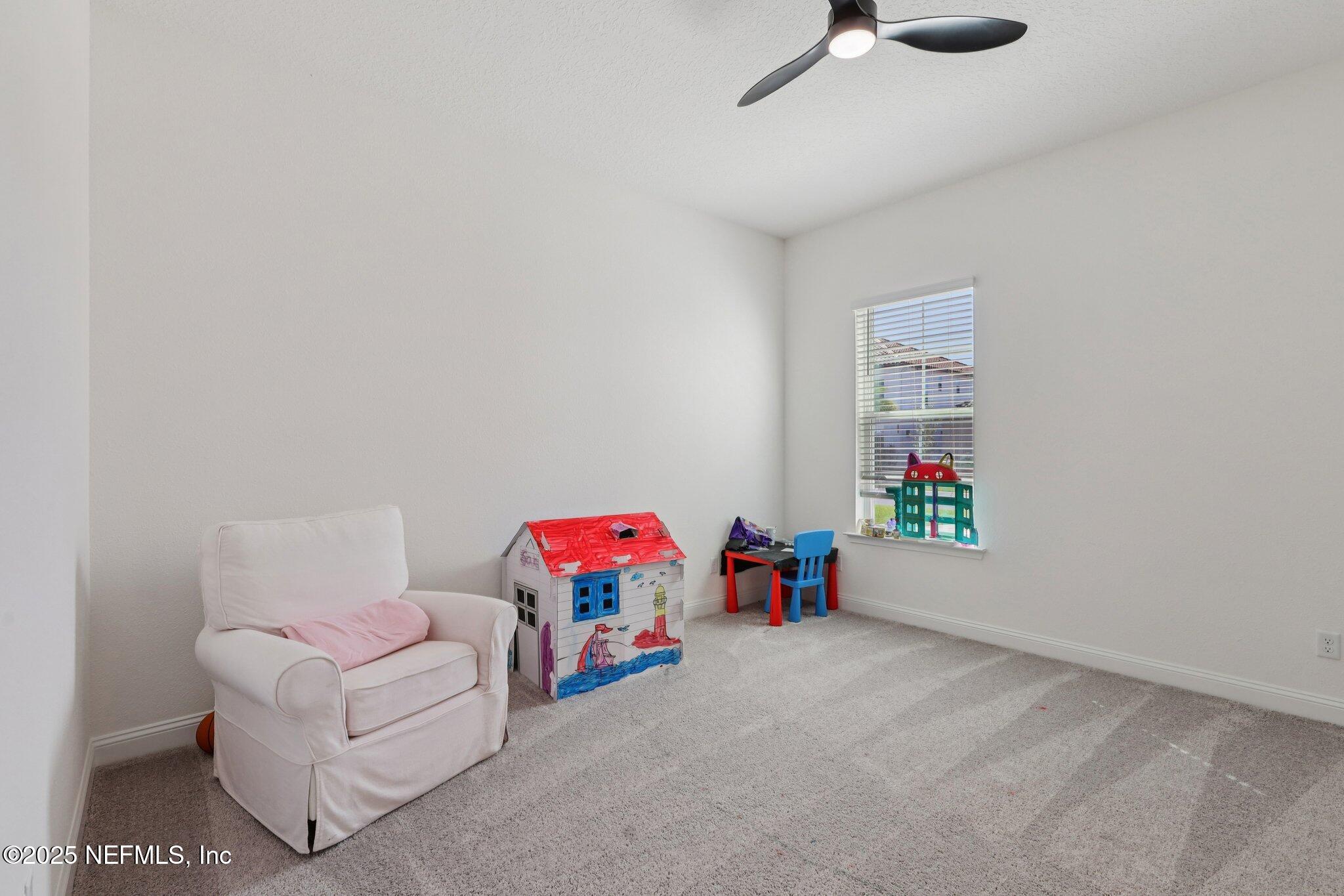 3089 Spiro Circle Jacksonville, FL 32246 - Photo 45 of 83 a living room with furniture and a window