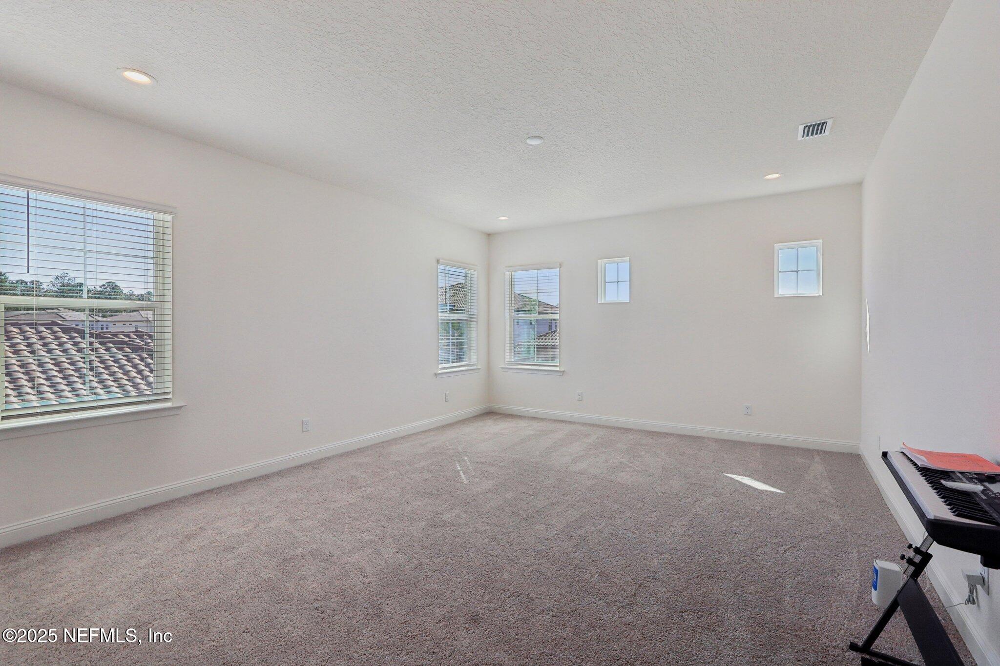 3089 Spiro Circle Jacksonville, FL 32246 - Photo 47 of 83 an empty room with windows