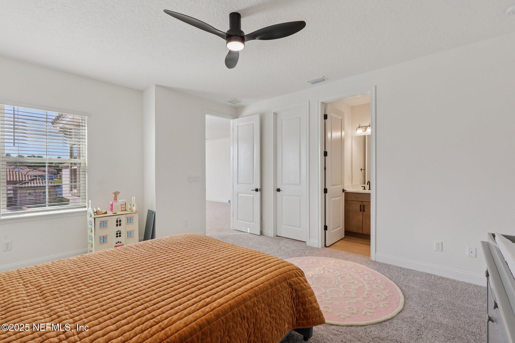 3089 Spiro Circle Jacksonville, FL 32246 - Photo 52 of 83 a bedroom with a bed and a window