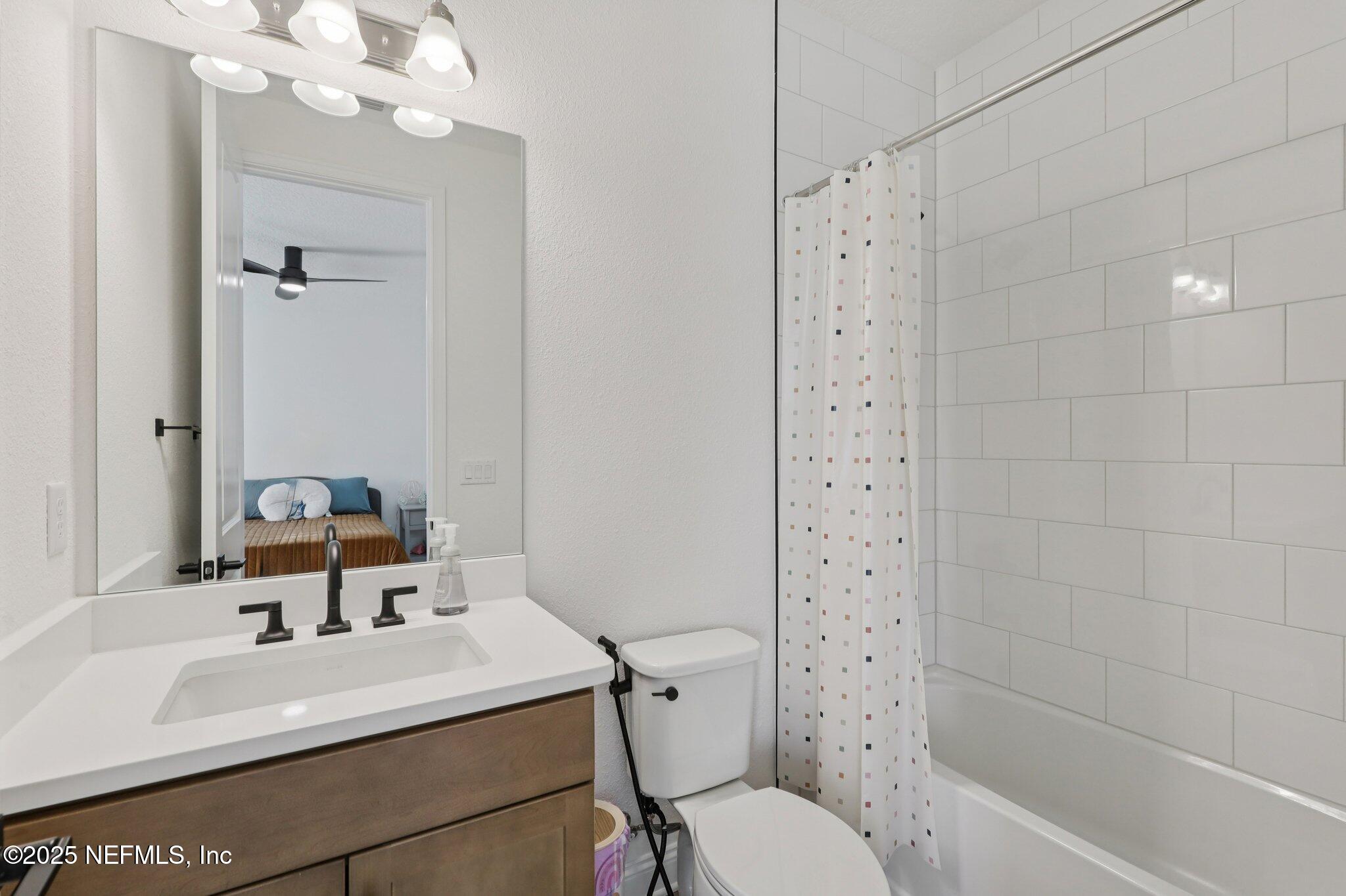 3089 Spiro Circle Jacksonville, FL 32246 - Photo 53 of 83 a bathroom with a sink a toilet and shower