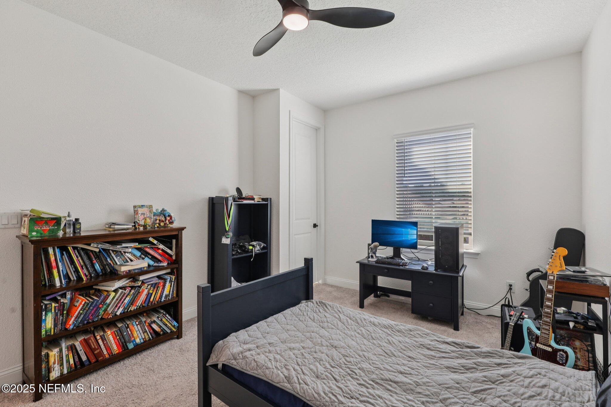 3089 Spiro Circle Jacksonville, FL 32246 - Photo 56 of 83 a bedroom with furniture and a book shelf