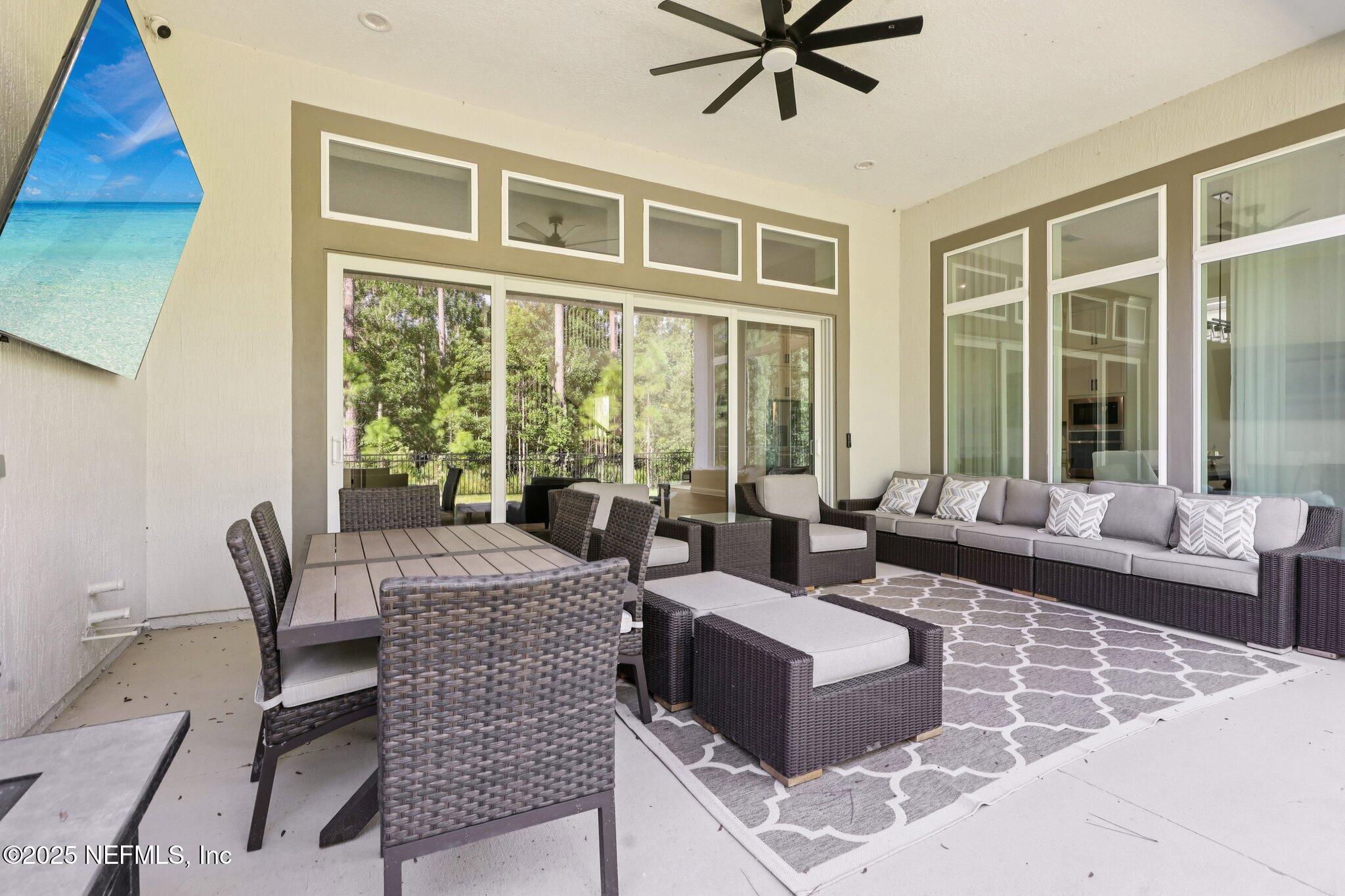3089 Spiro Circle Jacksonville, FL 32246 - Photo 59 of 83 a living room with furniture and a large window