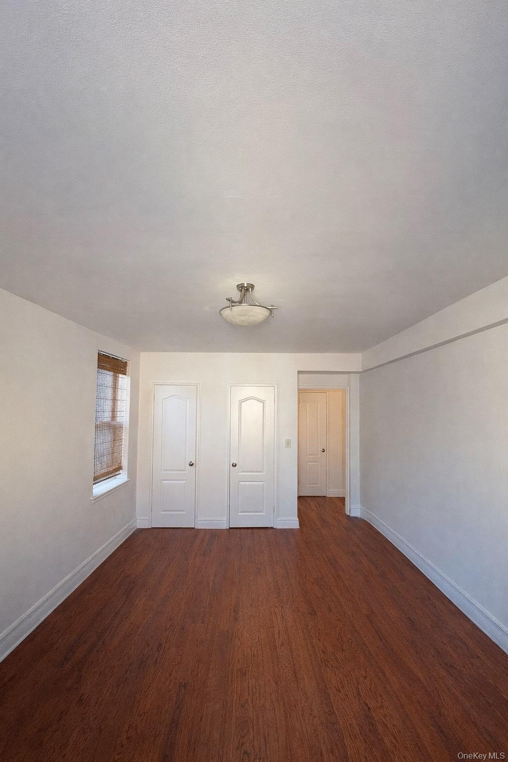 745 East 231st Street, Unit 6A Bronx, NY 10466 - Photo 2 of 7 an empty room with windows and closet