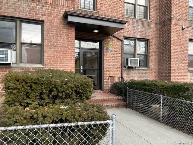 745 East 231st Street, Unit 6A Bronx, NY 10466 - Photo 6 of 7 a view of a house with a small yard and wooden floor and fence