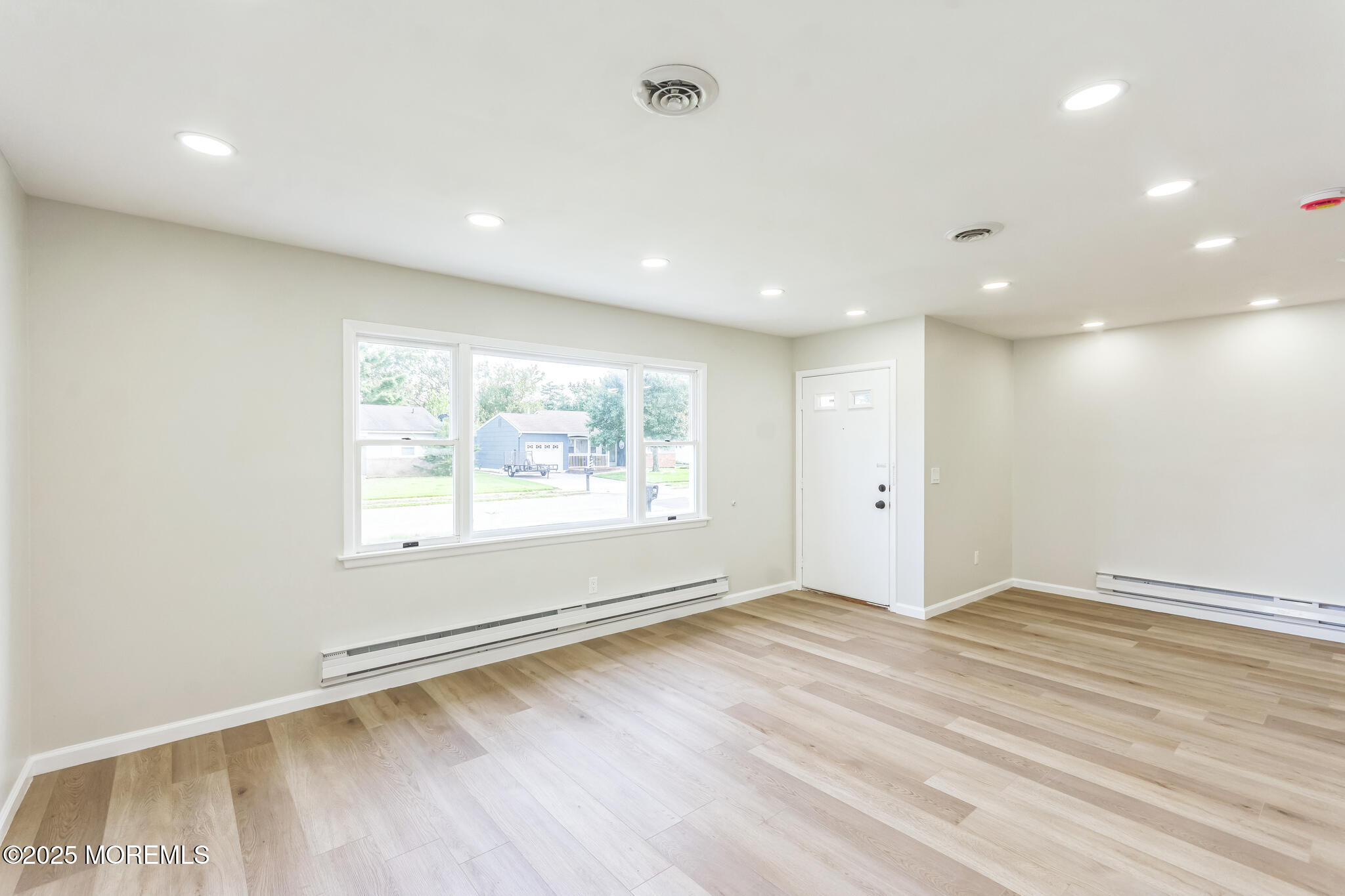 6 Eton Road Toms River, NJ 08757 - Photo 14 of 15 an empty room with wooden floor and windows