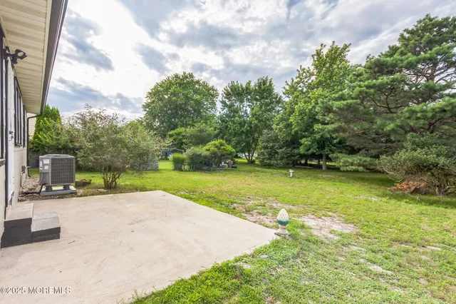 a view of a garden with a sitting area