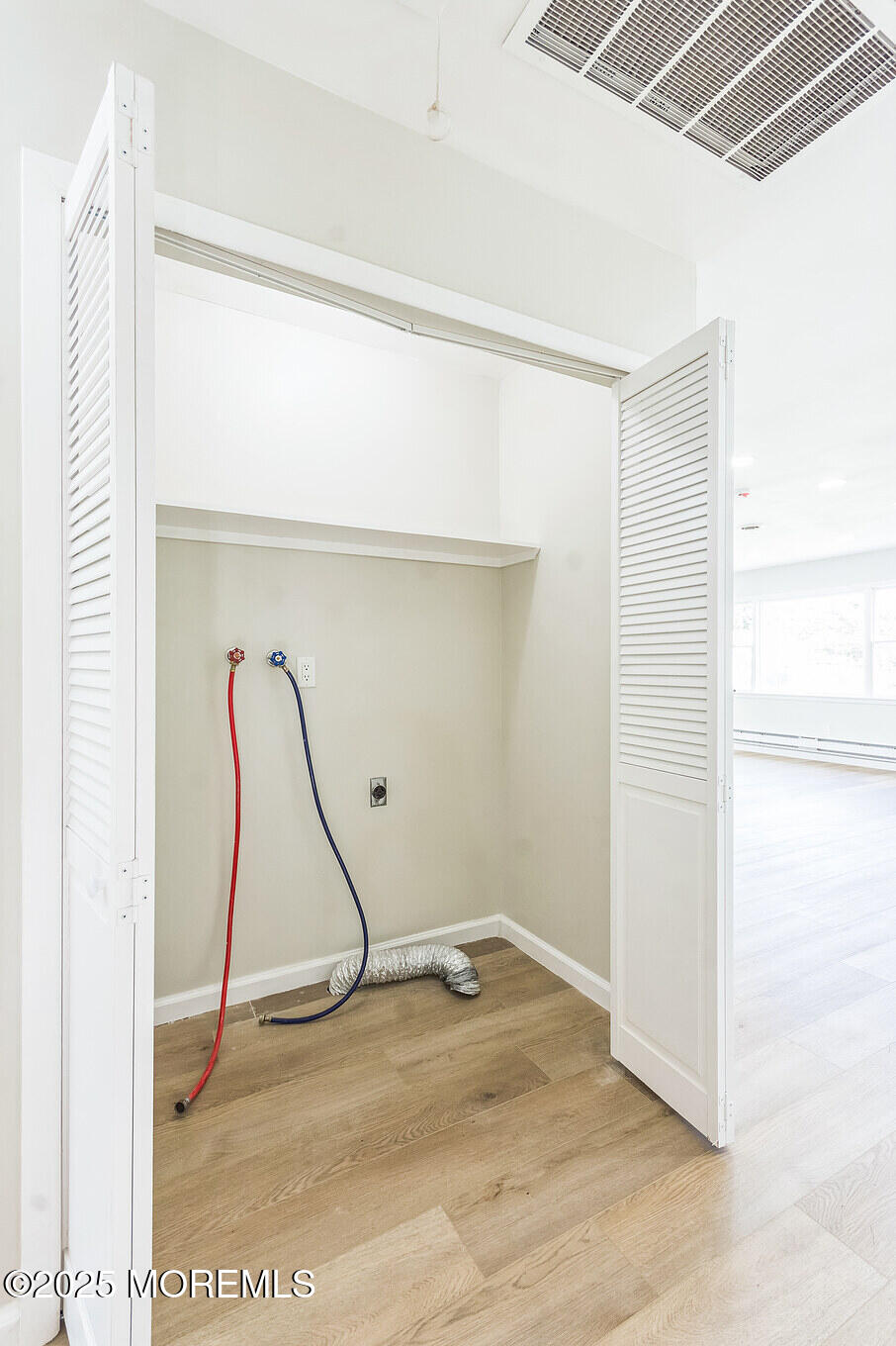 6 Eton Road Toms River, NJ 08757 - Photo 9 of 15 a room with a wooden floor and white walls