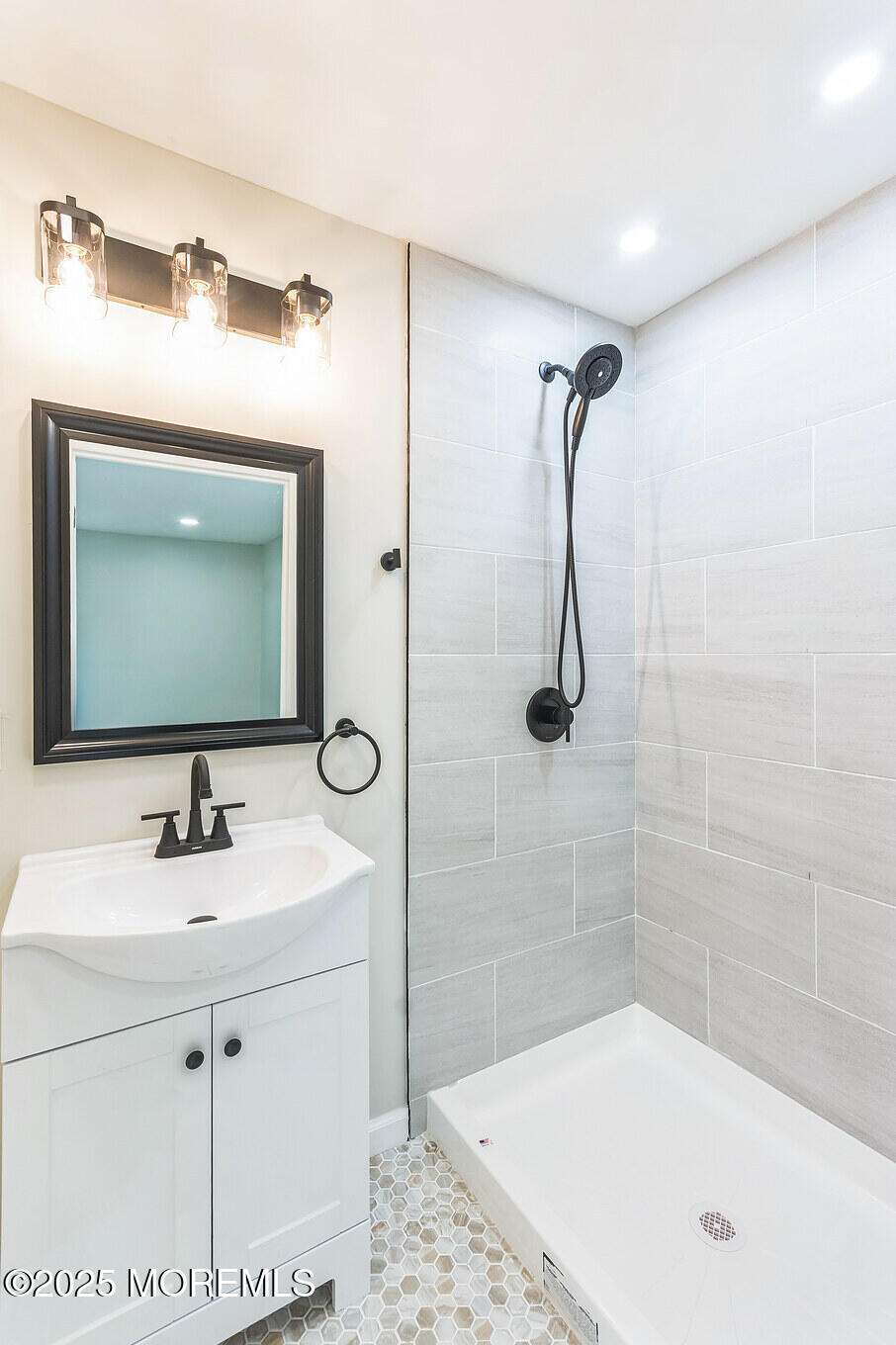 6 Eton Road Toms River, NJ 08757 - Photo 10 of 15 a bathroom with a sink a mirror and a bathtub