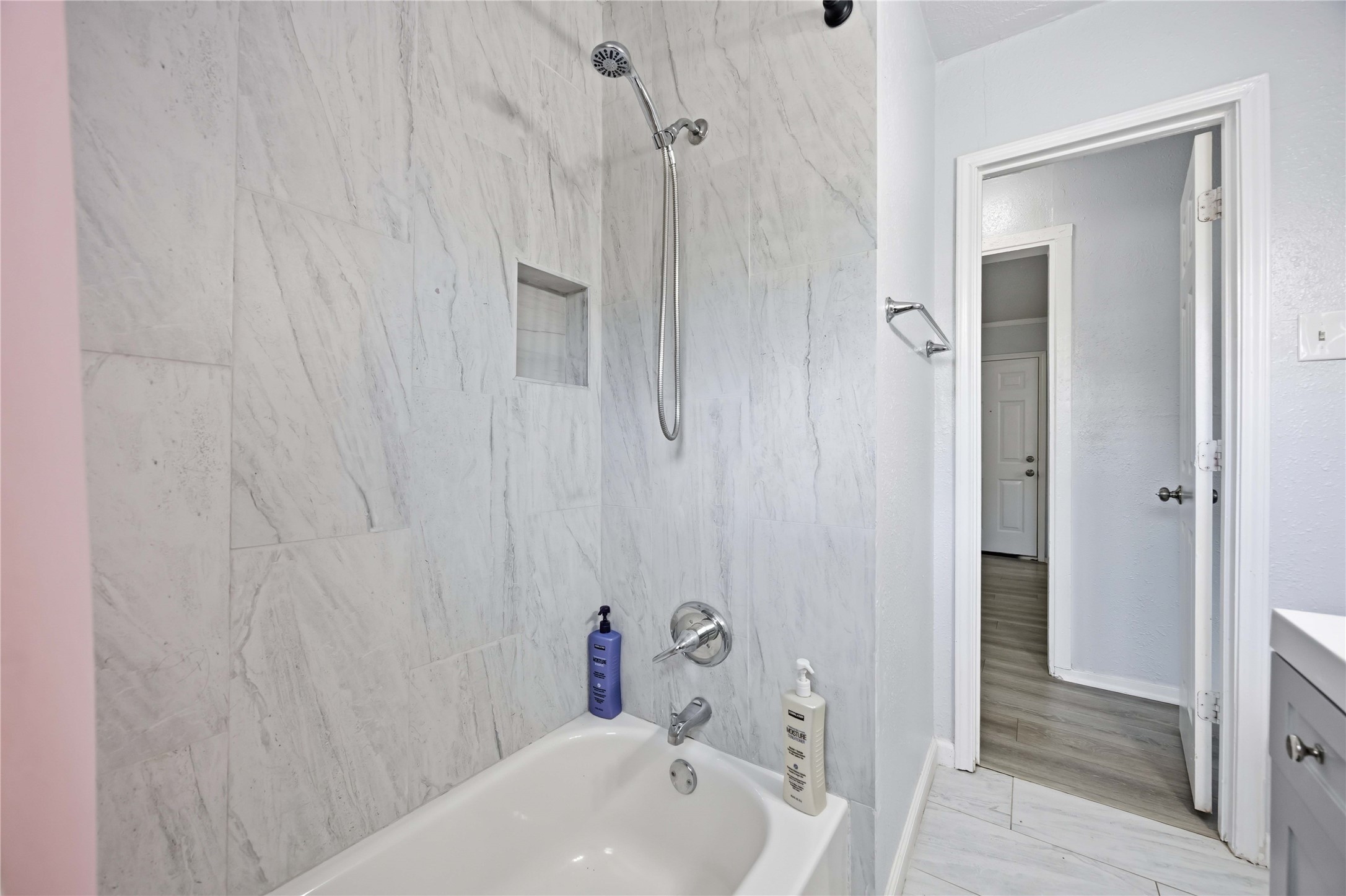 6726 Burkett Street Houston, TX 77021 - Photo 10 of 18 a bathroom with a sink and shower