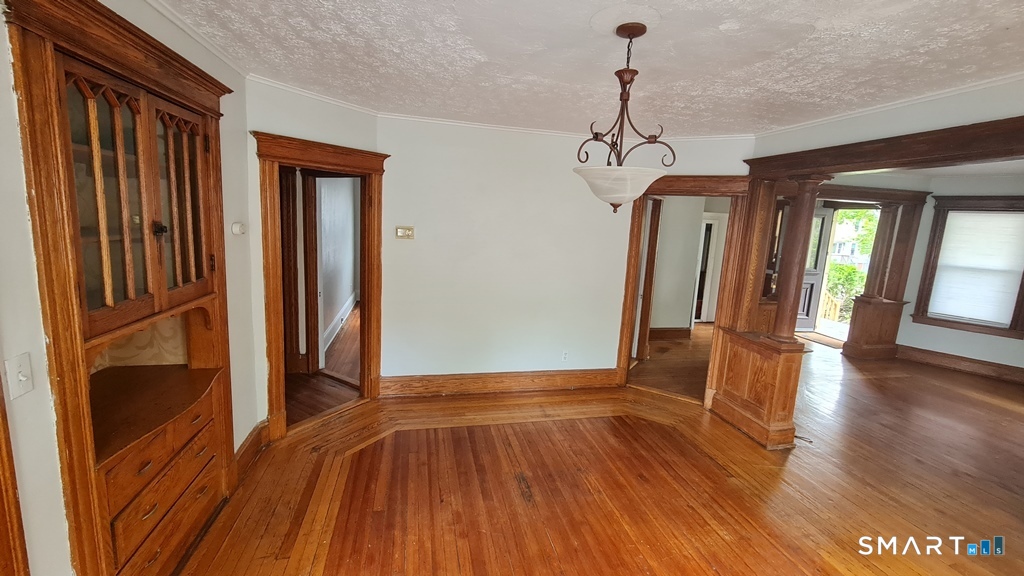 64-66 Ridge Street Manchester, CT 06040 - Photo 15 of 21 a view of a room with wooden floor and stairs