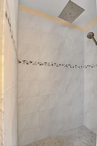 a view of balcony with wooden floor and fence