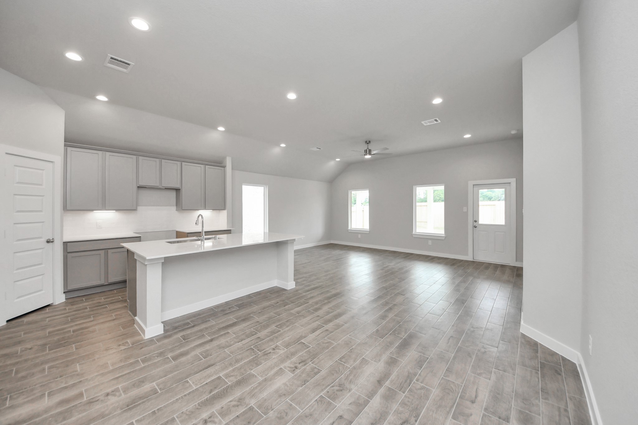 14623 Diamond Dove Lane Houston, TX 77049 - Photo 12 of 27 Craft enduring memories with loved ones around the table! This roomy dining area boasts stylish flooring, personalized paint, and is conveniently situated next to the family room and kitchen, fostering an open and inclusive ambiance. Sample photo of completed home with similar floor plan. Actual colors and selections may vary.