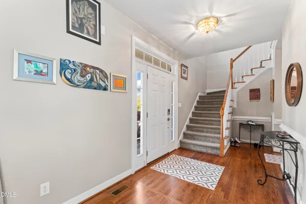a view of an entryway with wooden floor