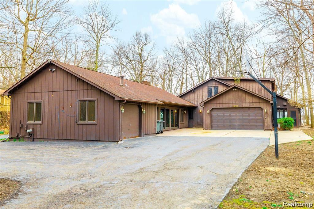 19130 Meridian Road Grosse Ile, MI 48138 - Photo 1 of 49 Welcome to 19130 Meridian Rd, a peaceful waterfront and wooded sanctuary.