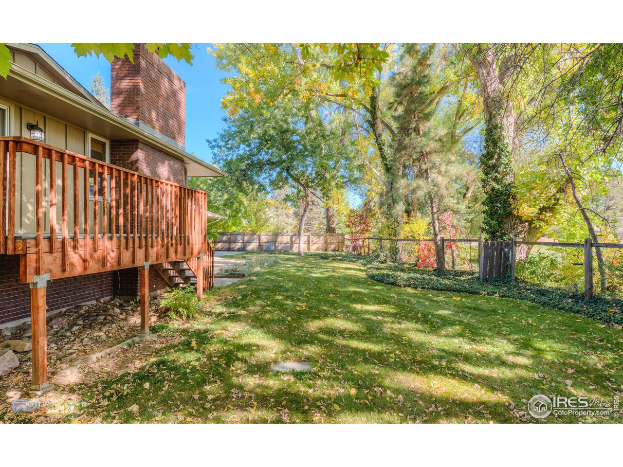 5484 Cypress Drive Boulder, CO 80303 - Photo 11 of 35 a view of a backyard with wooden fence