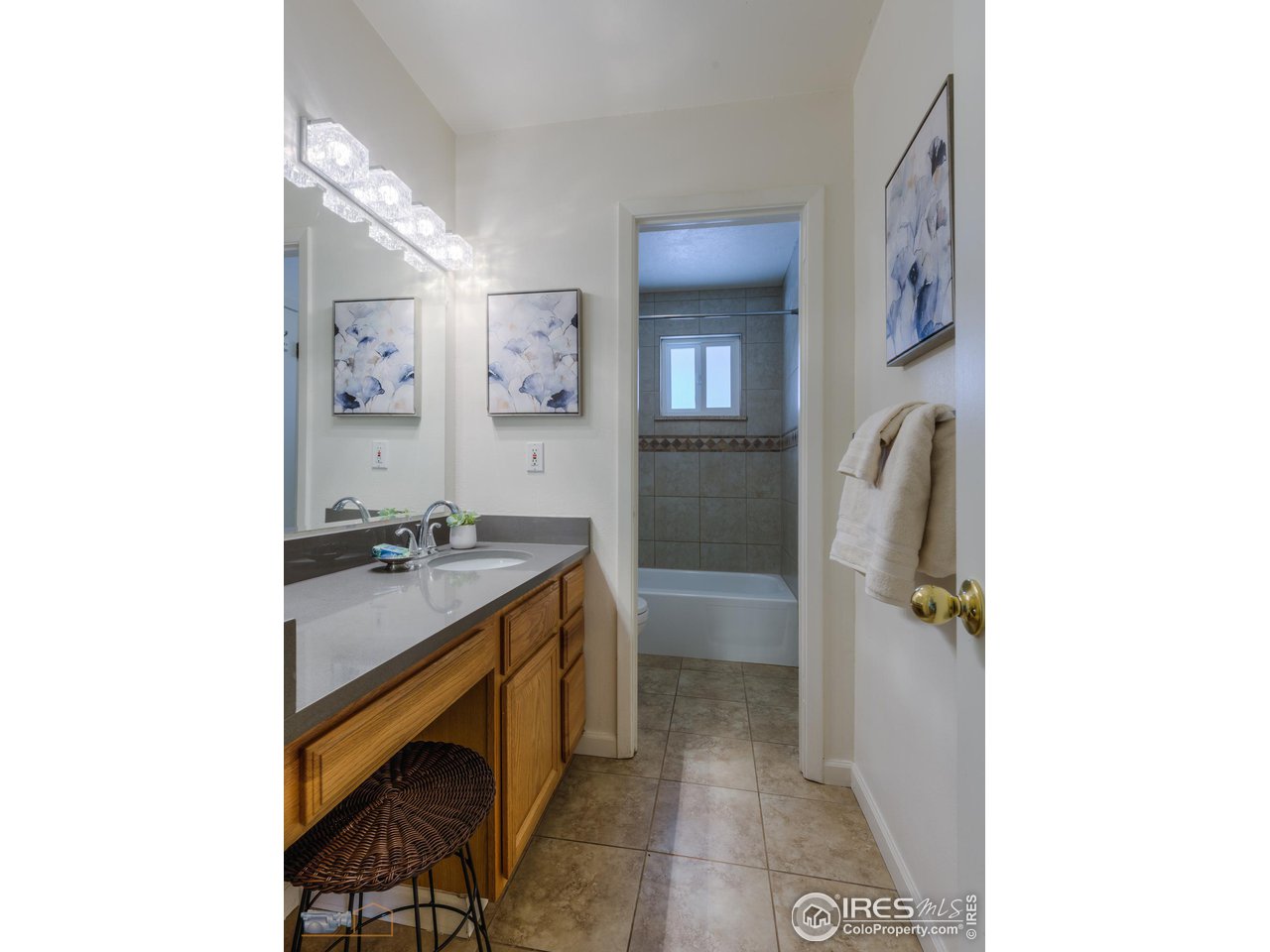 5484 Cypress Drive Boulder, CO 80303 - Photo 17 of 35 a bathroom with a granite countertop sink and a mirror