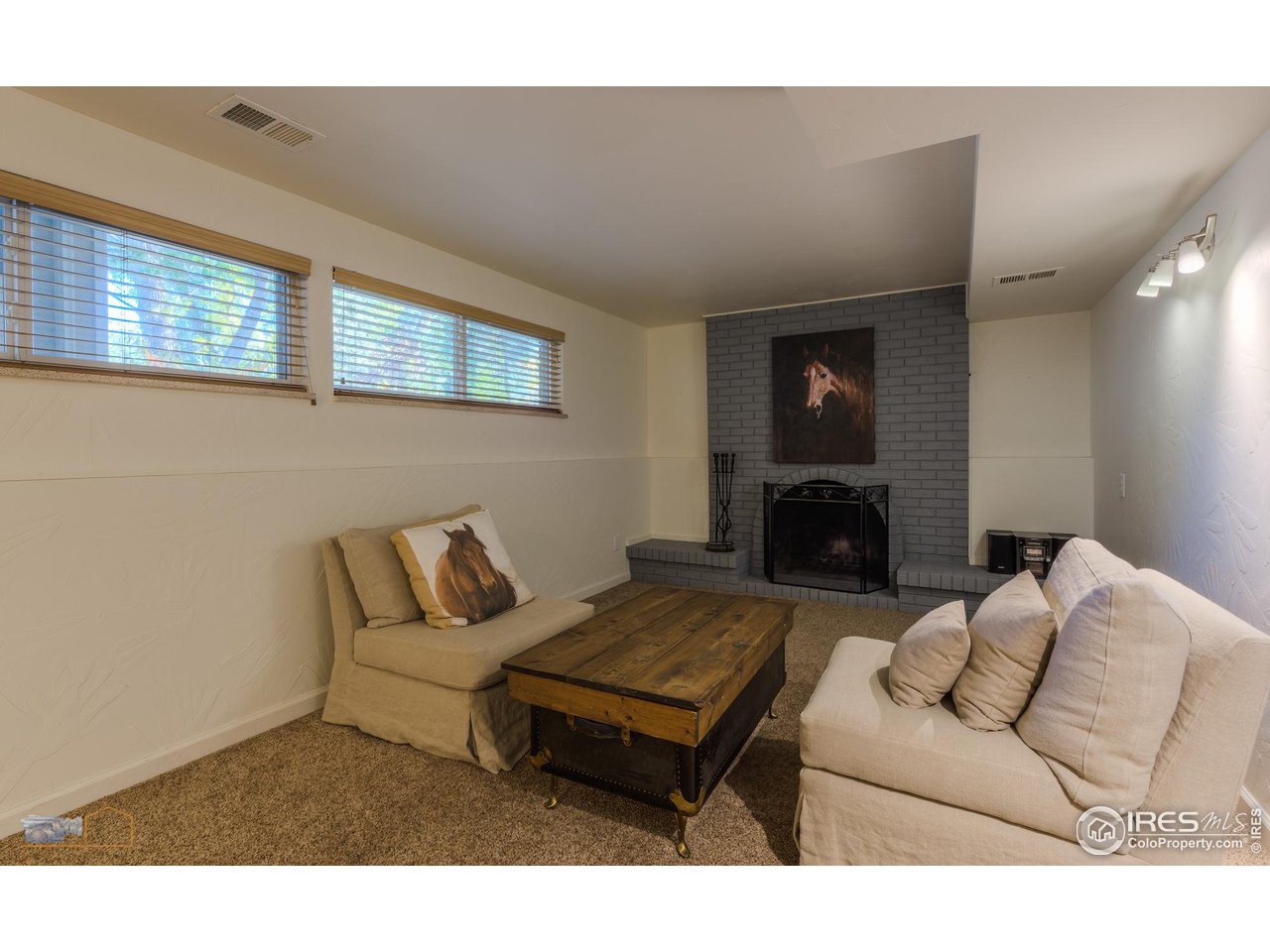 5484 Cypress Drive Boulder, CO 80303 - Photo 18 of 35 a living room with furniture and a fireplace