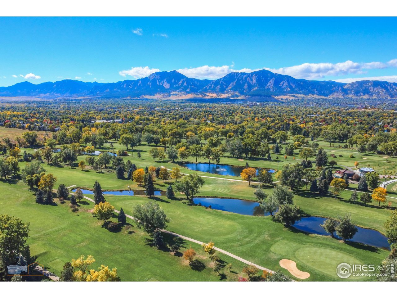 5484 Cypress Drive Boulder, CO 80303 - Photo 34 of 35 a view of a house with a yard and mountain