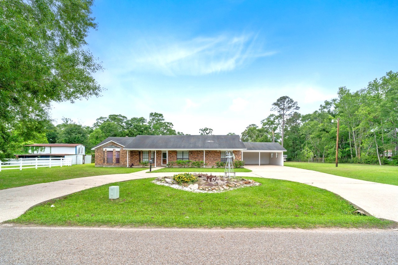 13180 Morgan Drive Splendora, TX 77372 - Photo 35 of 38 To the right of the home there is a separate septic system allowing another home to sit on the property.