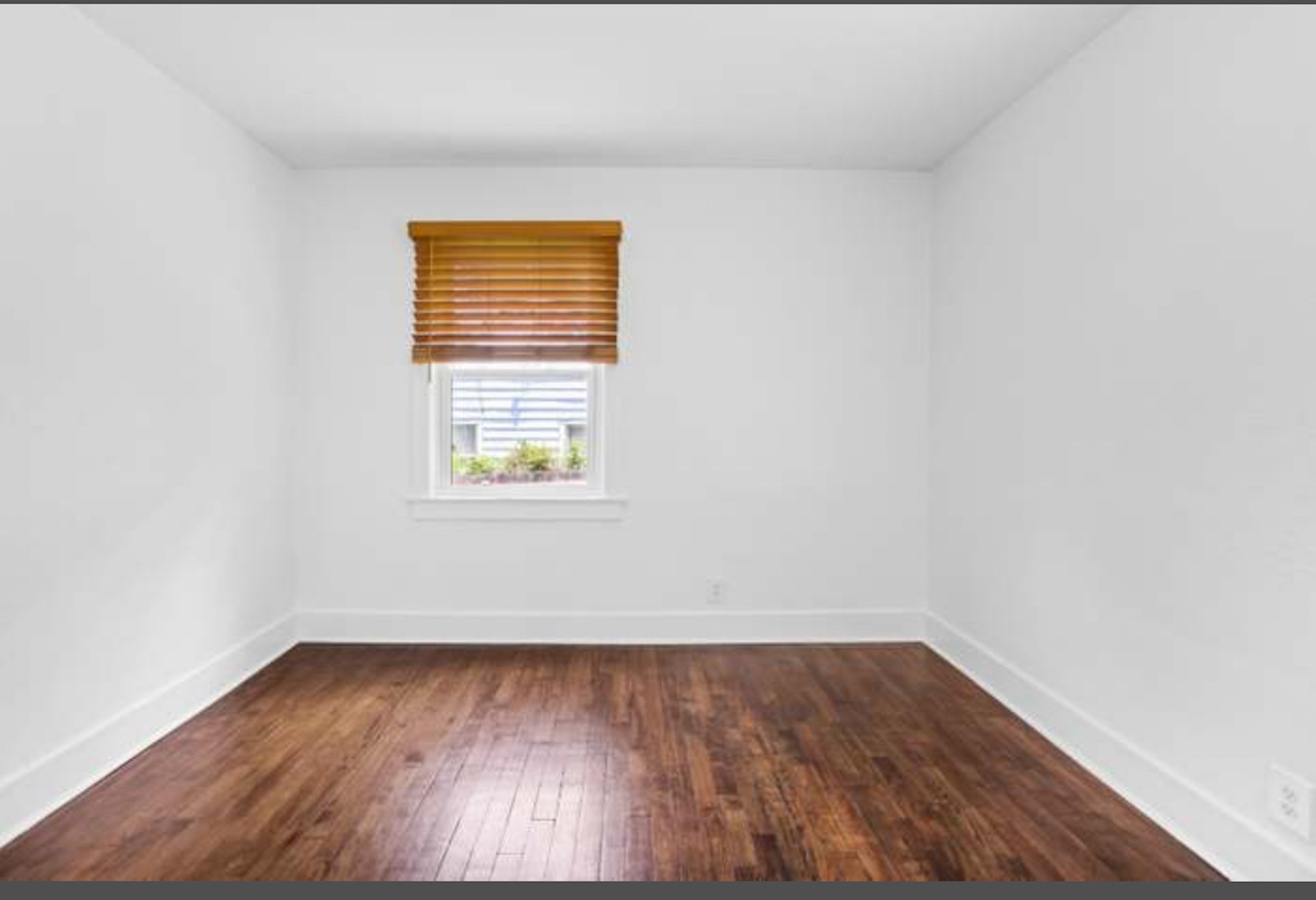 417 Lanier Drive Madison, TN 37115 - Photo 11 of 11 a view of an empty room with wooden floor and a window