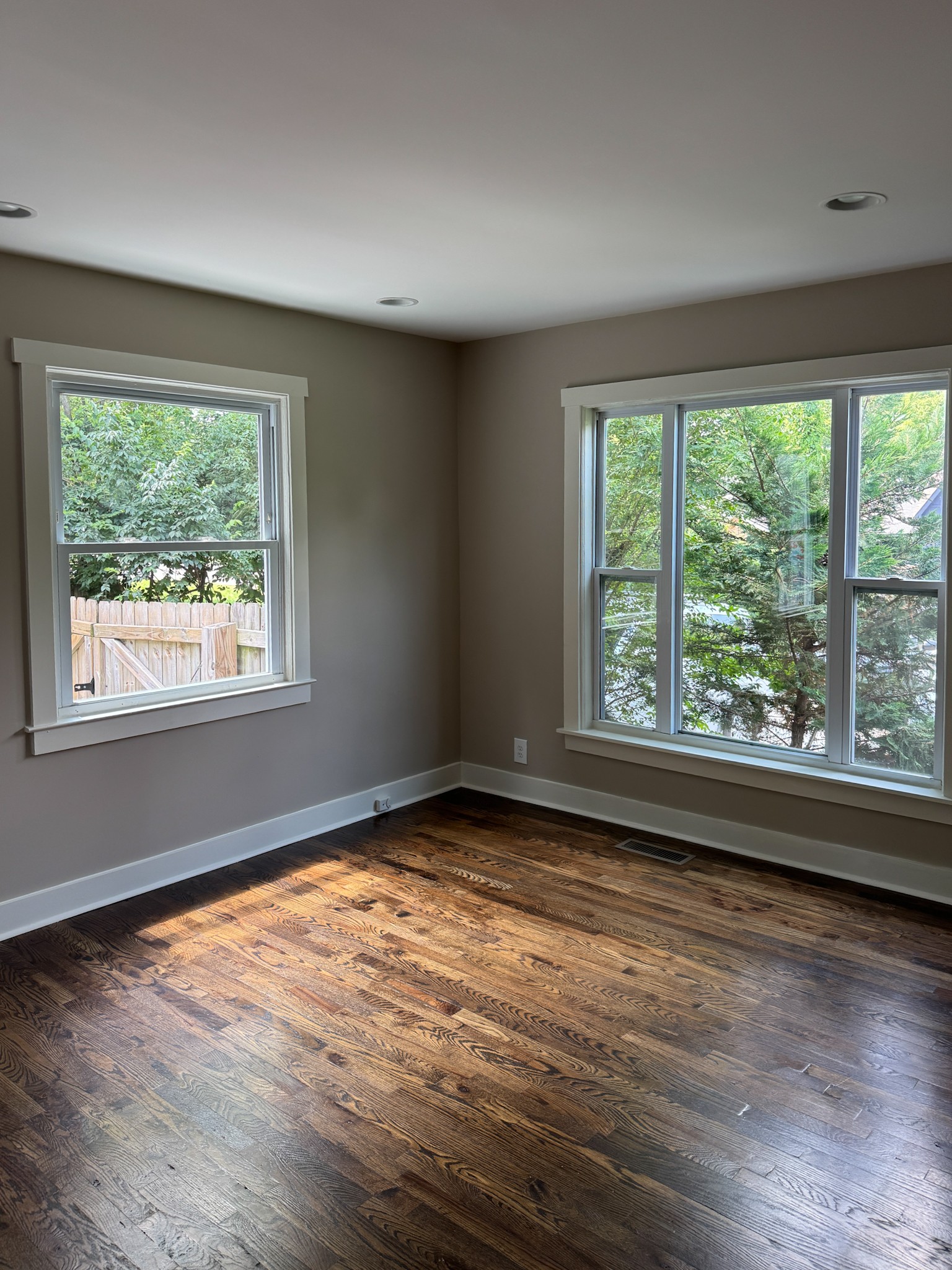 417 Lanier Drive Madison, TN 37115 - Photo 7 of 11 a view of an empty room with wooden floor and a window