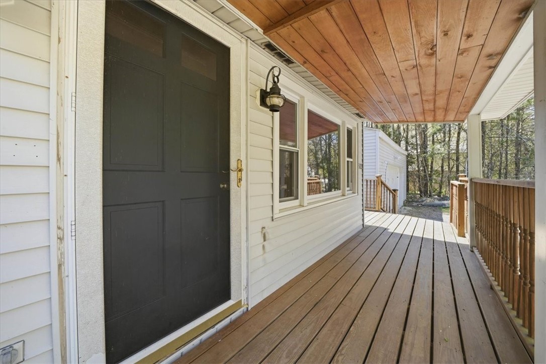 322 Rocky Hill Road Scituate, RI 02857 - Photo 6 of 50 Iconic New England farmer’s porch sets the tone for this home—an inviting space to unwind with morning coffee, host summer evenings, or simply enjoy the neighborhood charm.